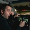 Tired driver at night showing fatigue warning signs that can lead to drowsy driving accidents