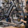 Mechanic inspecting an e-bike for wheel and seat-post defects
